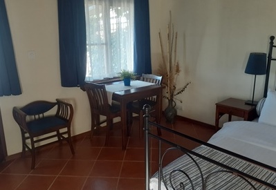 an indoor dining area with table and chairs